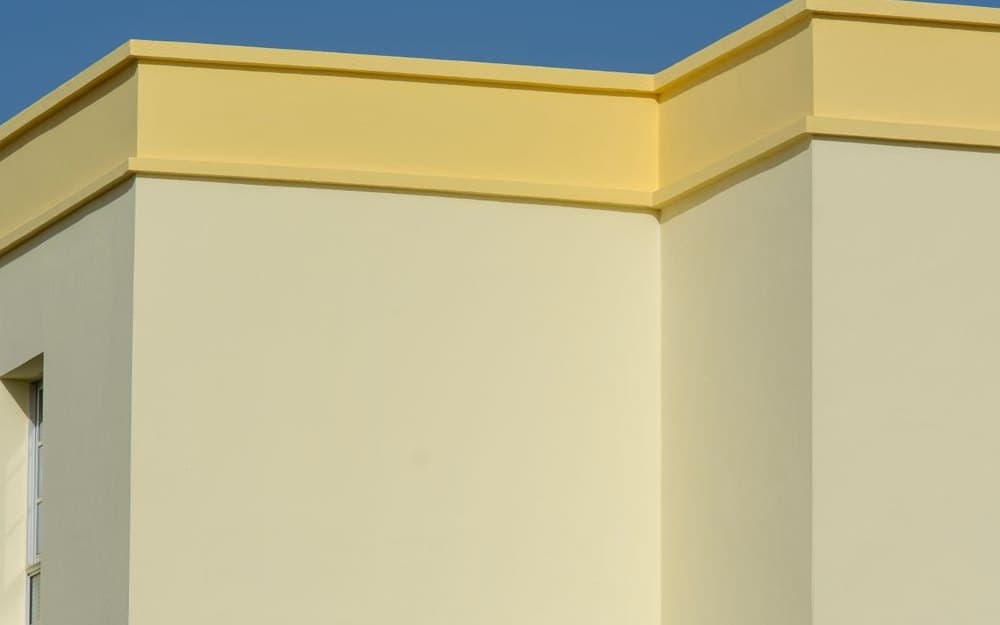 Rendered exterior facade with a moulded profile