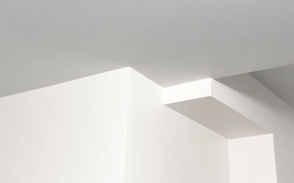 Crisply profiled cornice along a ceiling